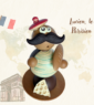 Personnage en chocolat, lucien le Parisien, en marinière et baguette de pain à la main avec un béret et un morceau de fromage